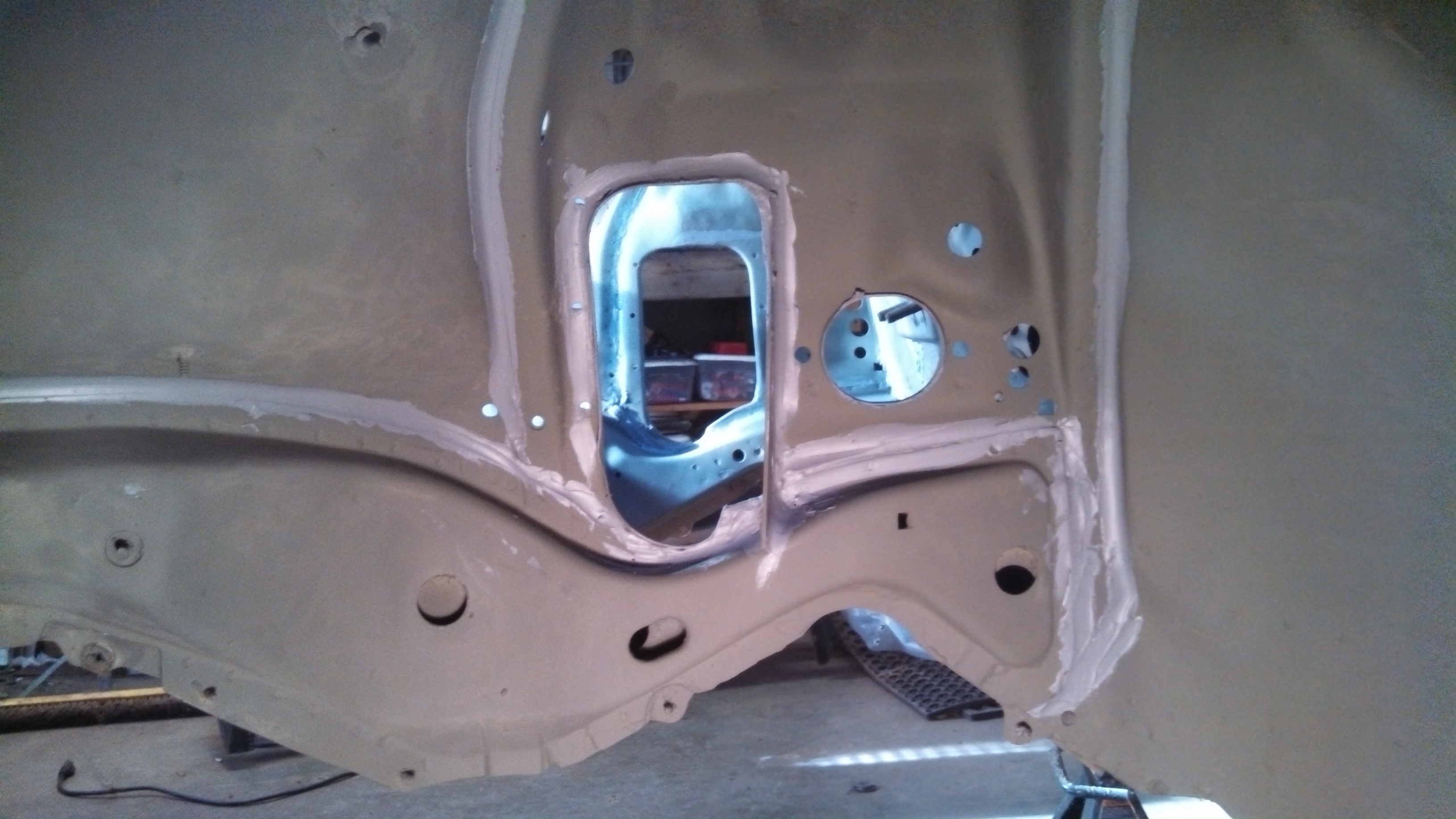 steering arm holes and brace welded and sealed2.jpg