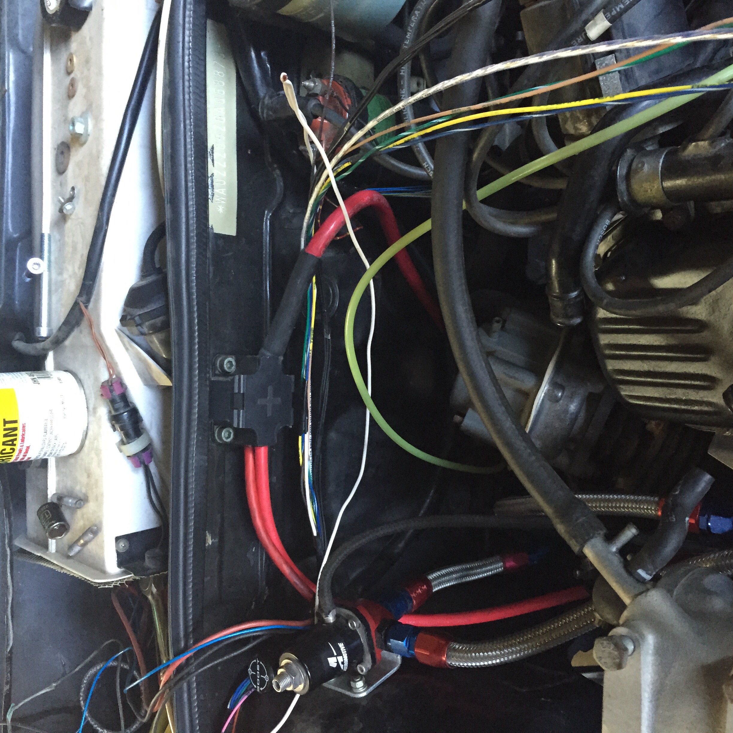 Relocated battery terminal to firewall.