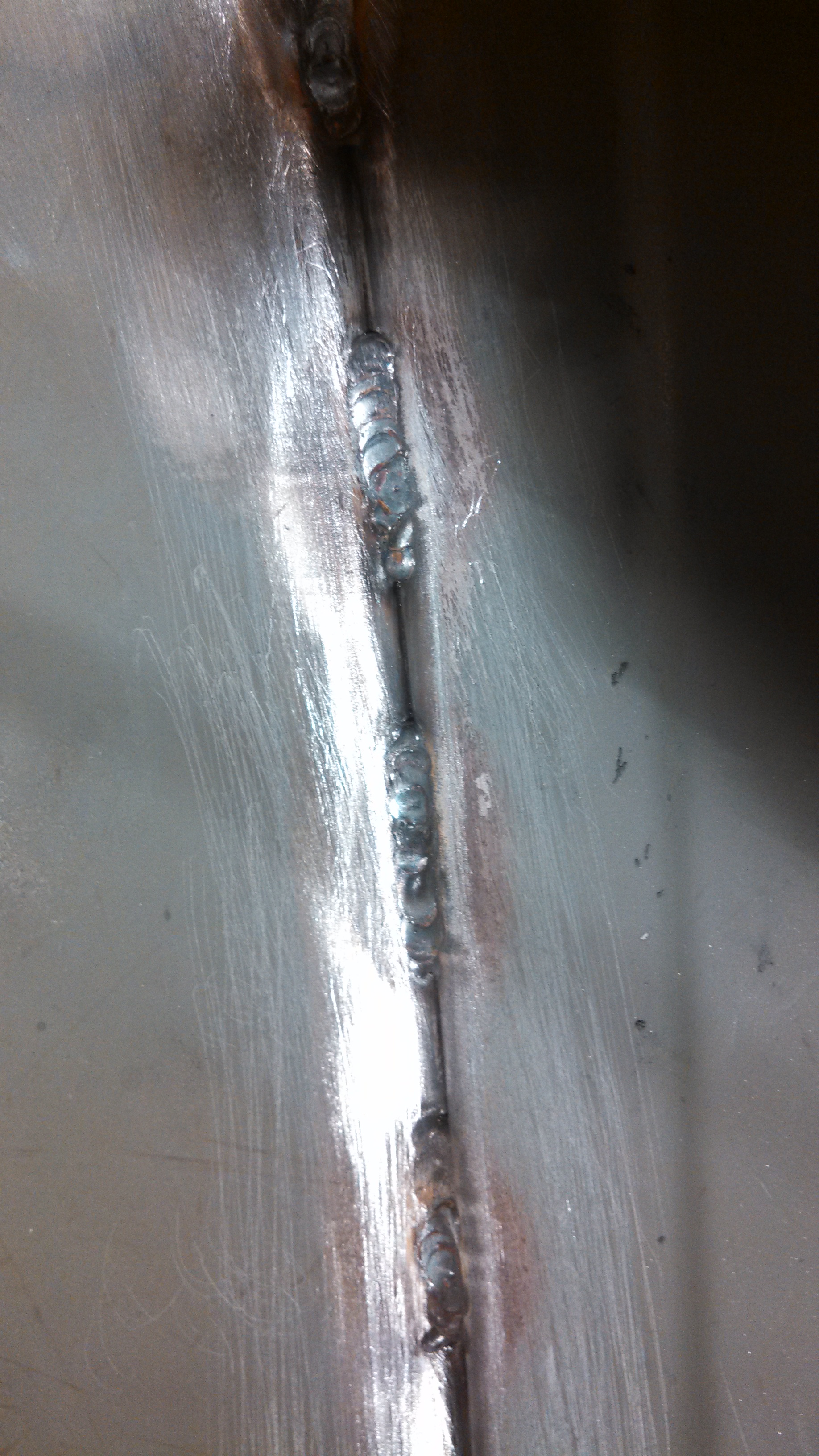 seam stitched driver rear wheel well.jpg