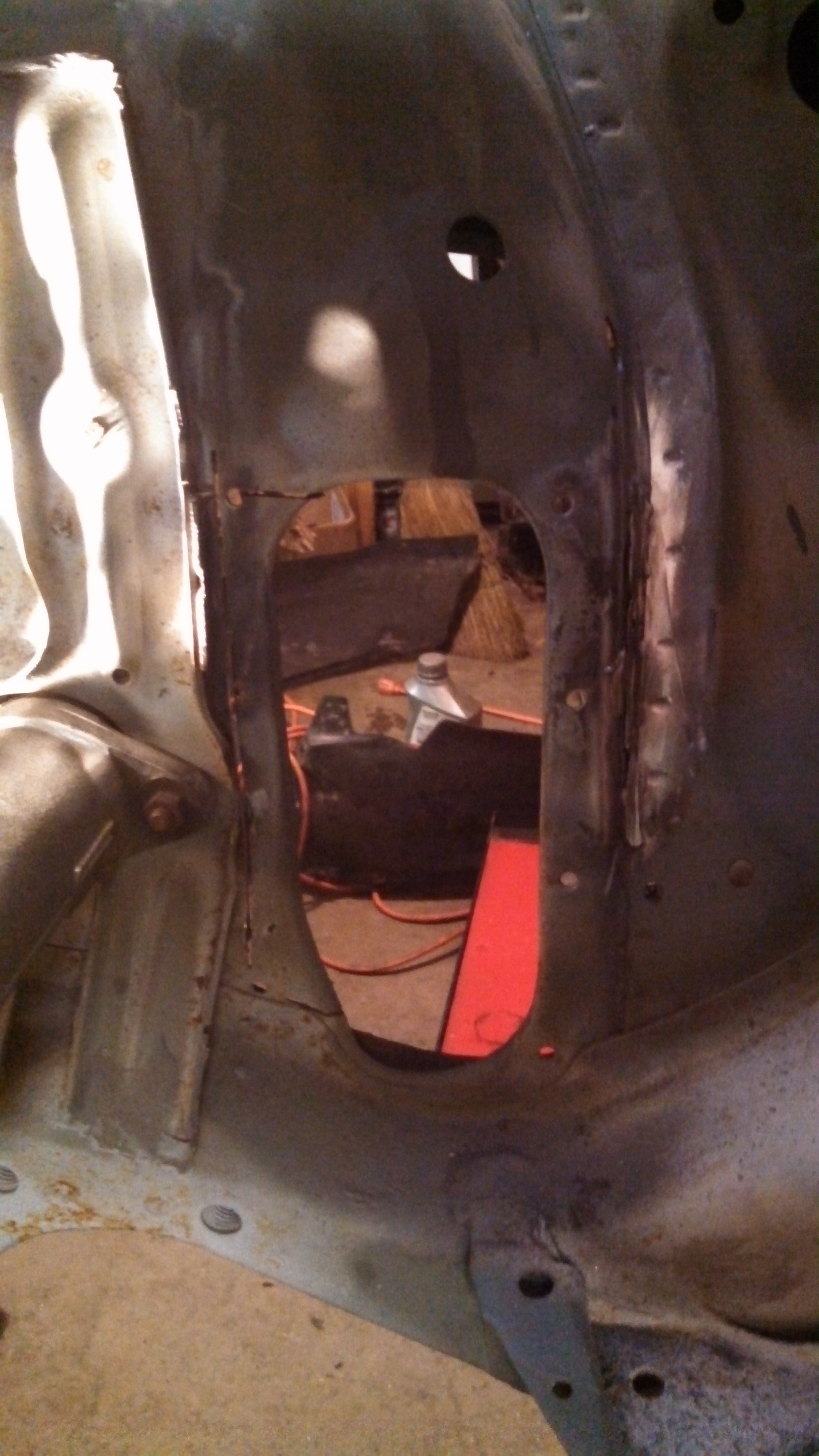 cutting out Drivers steering arm hole.jpg